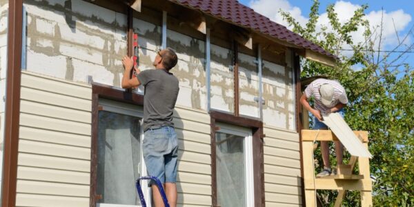man repairing house